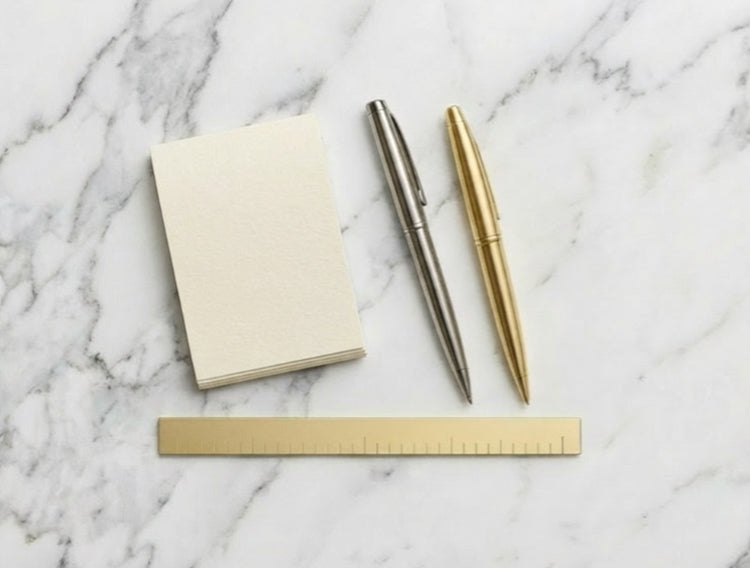 Tools to measure ring size at home – ruler, pen, and notepad for sizing