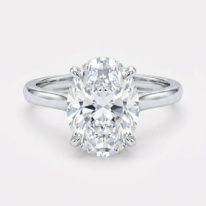 Tresor Diamond The Alouette Ring featuring a sleek silver band and a sparkling central gemstone, showcasing elegant jewelry design.