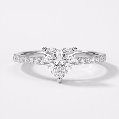 Close-up of Tresor Diamond's The Amoria Ring featuring intricate design and sparkling gemstones in a luxurious gold setting.