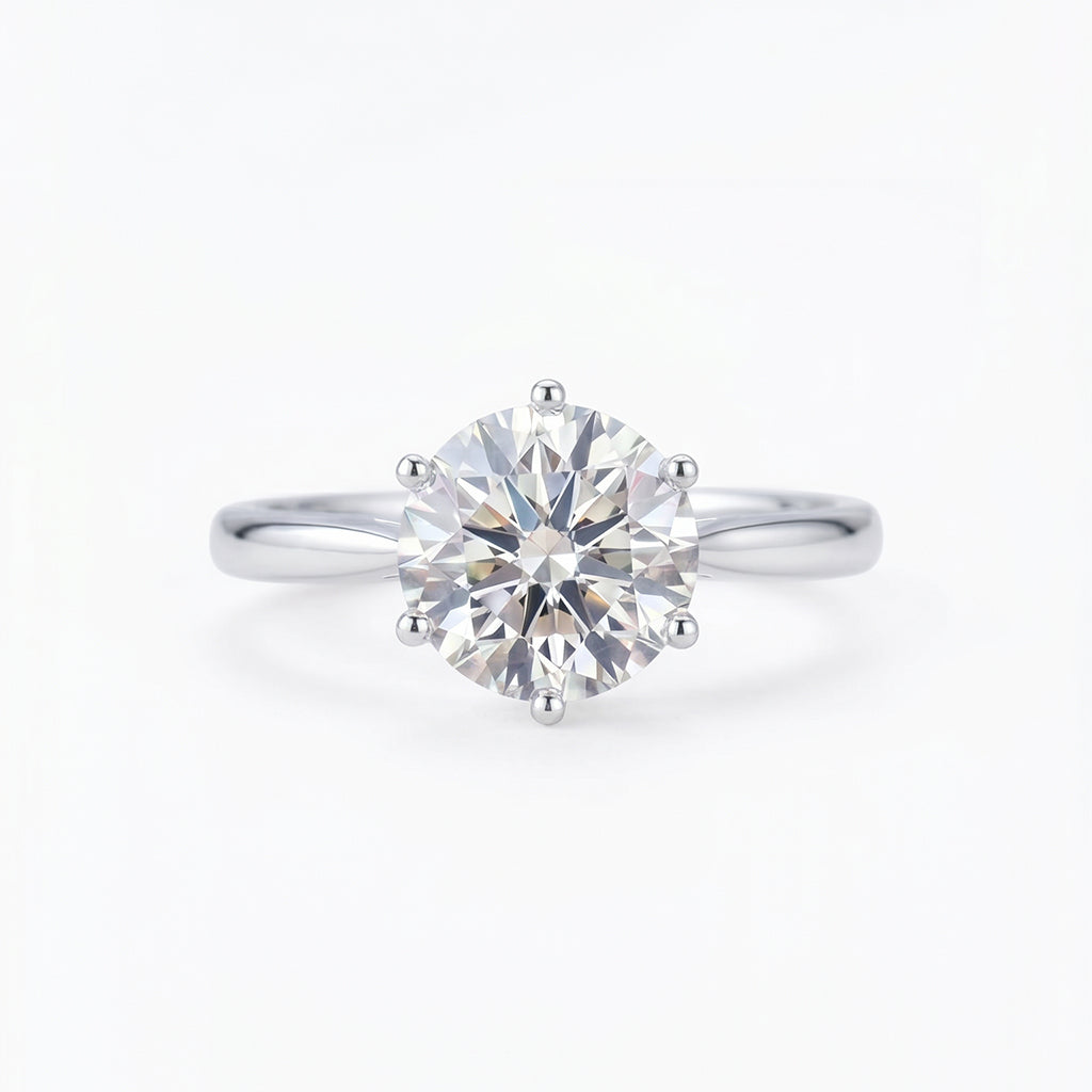 Close-up of Tresor Diamond's The Celina Ring featuring a sparkling diamond band on a sleek gold setting.