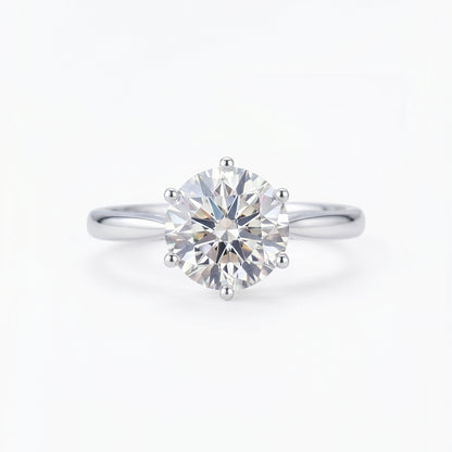 Close-up of Tresor Diamond's The Celina Ring featuring a sparkling diamond band on a sleek gold setting.