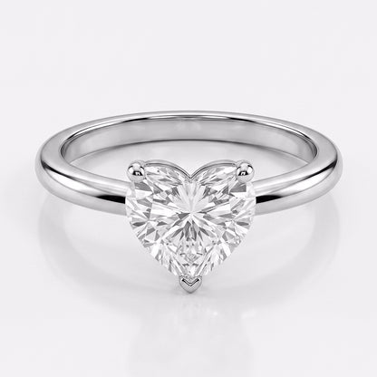 Elegant gold Elysia Ring by Tresor Diamond featuring a sparkling central gemstone and intricate band design.