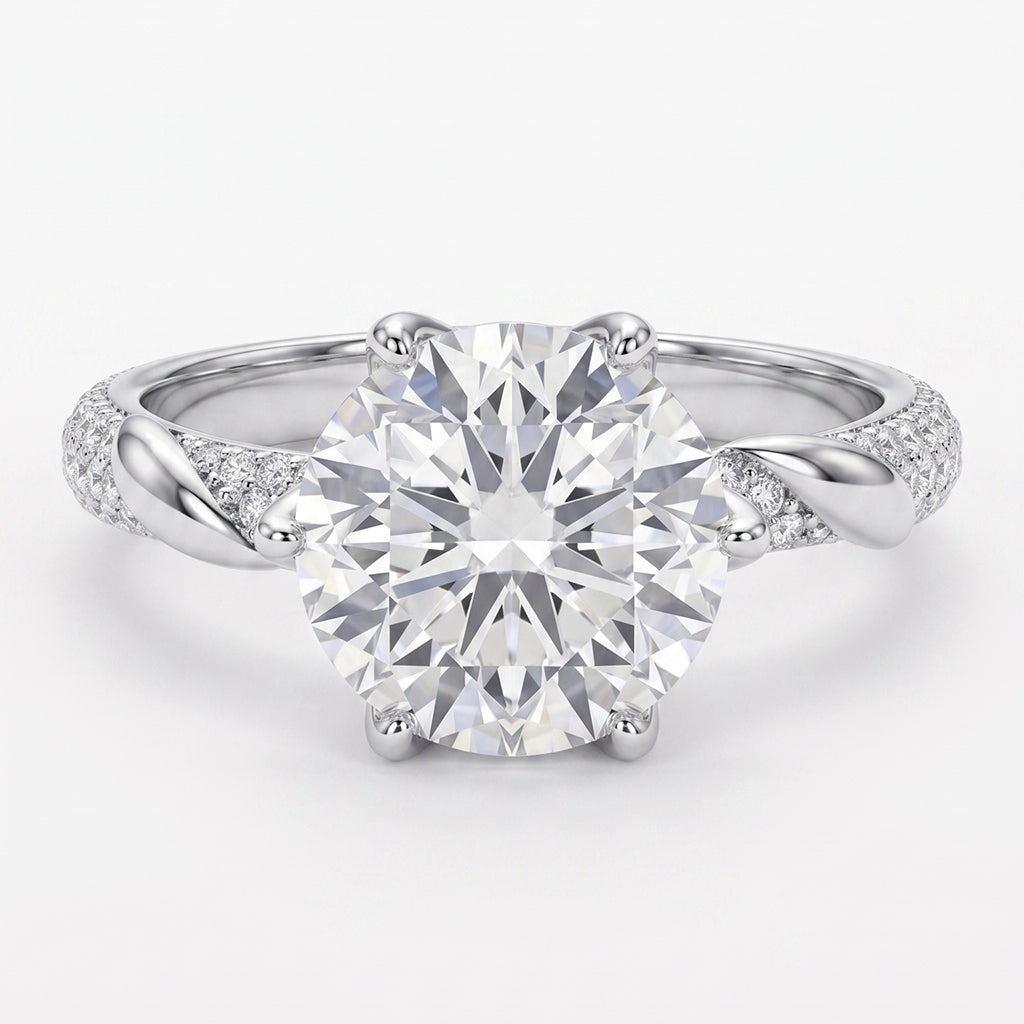 Close-up of Tresor Diamond's The Grace Ring with sparkling gemstones and intricate band design on a white background.