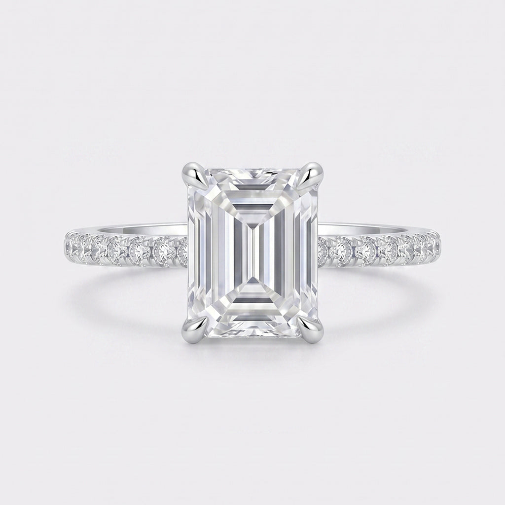 The Lenora Ring by Tresor Diamond featuring a delicate band with a sparkling central diamond and intricate metalwork.