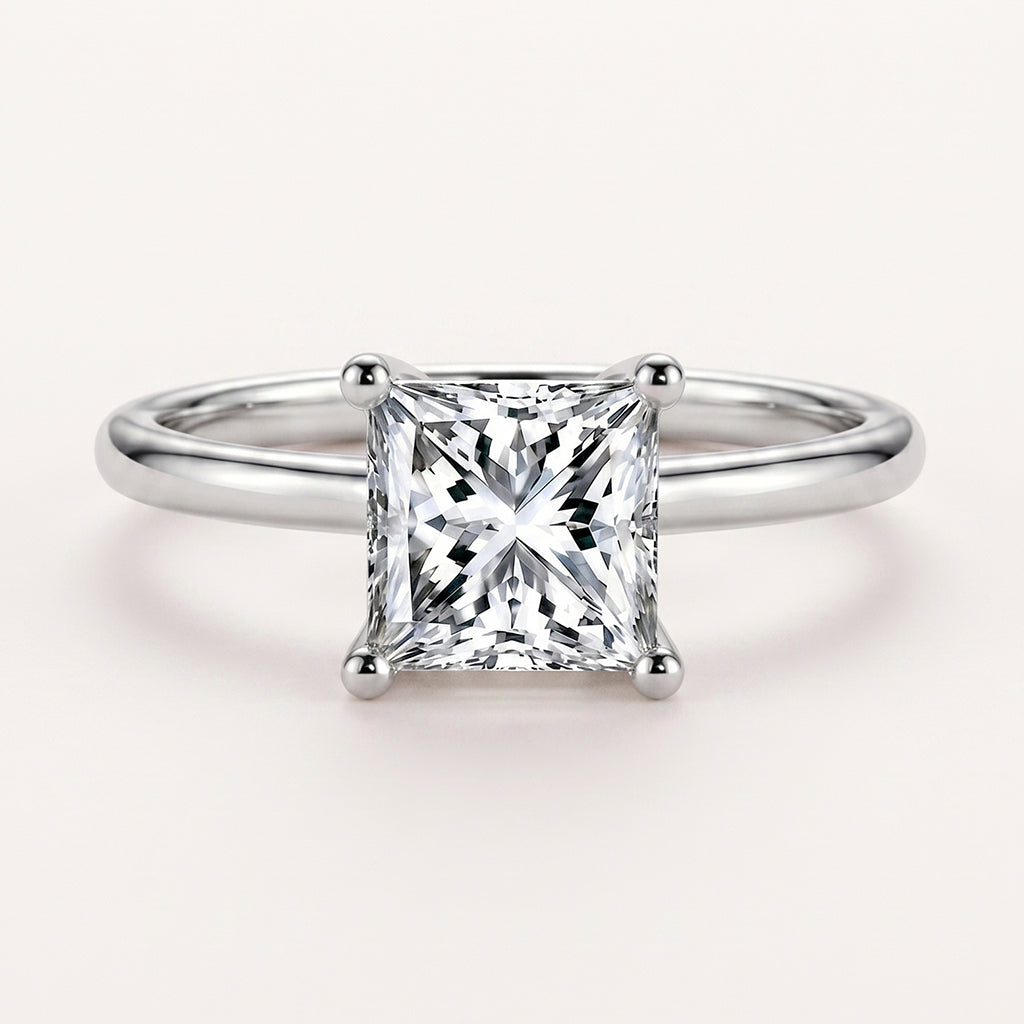 The Serenia Ring by Tresor Diamond features a sparkling gemstone set in a delicate gold band on a white background.