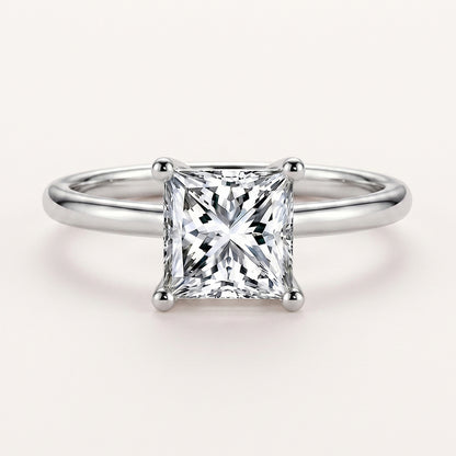 The Serenia Ring by Tresor Diamond features a sparkling gemstone set in a delicate gold band on a white background.