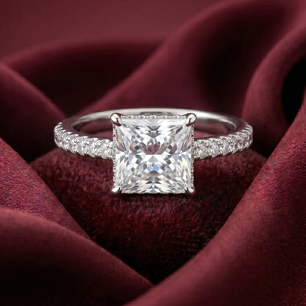 Shiny gold Tresor Diamond Vionara Ring with intricate design and sparkling gemstone detailing on a white background.