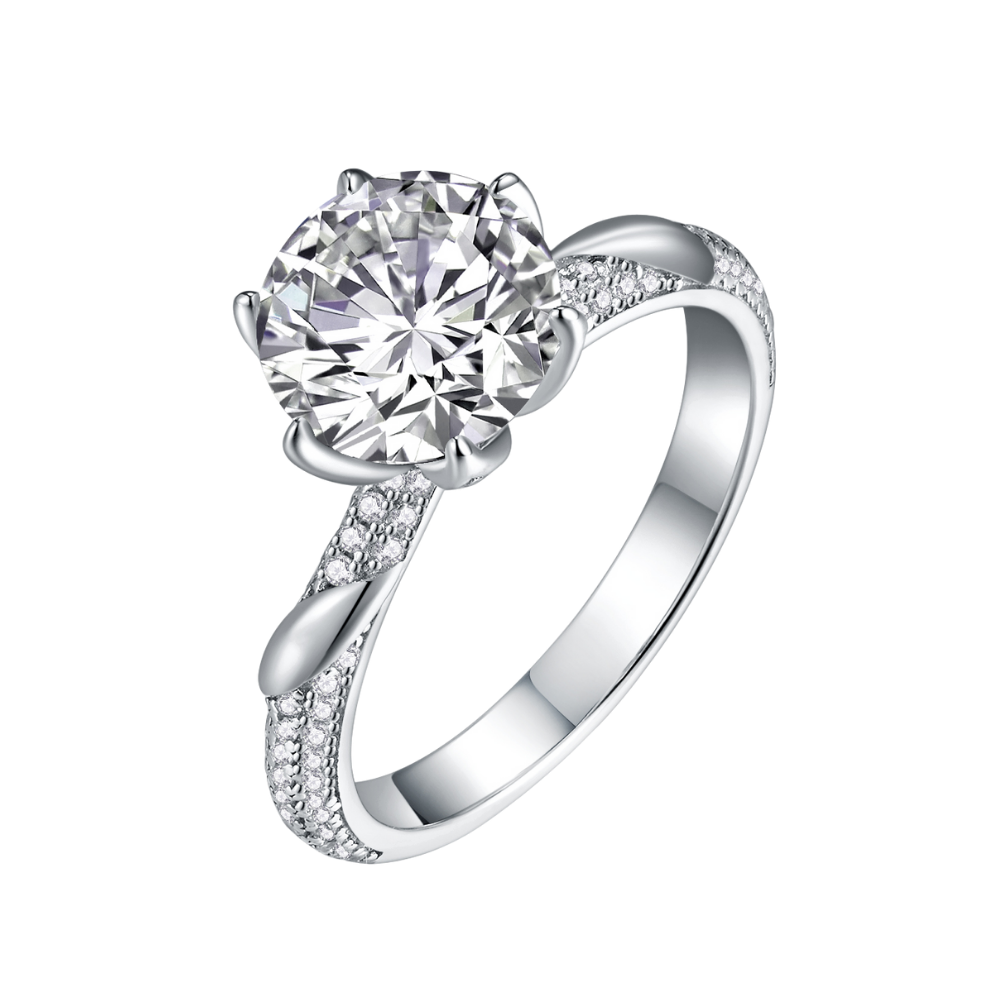 Elegant Tresor Diamond Grace Ring featuring a delicate band and sparkling center stone, set against a soft background.
